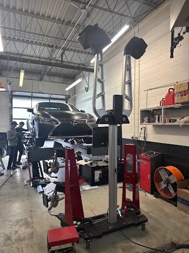 Vehicle on a lift inside the Tatar Motors workshop